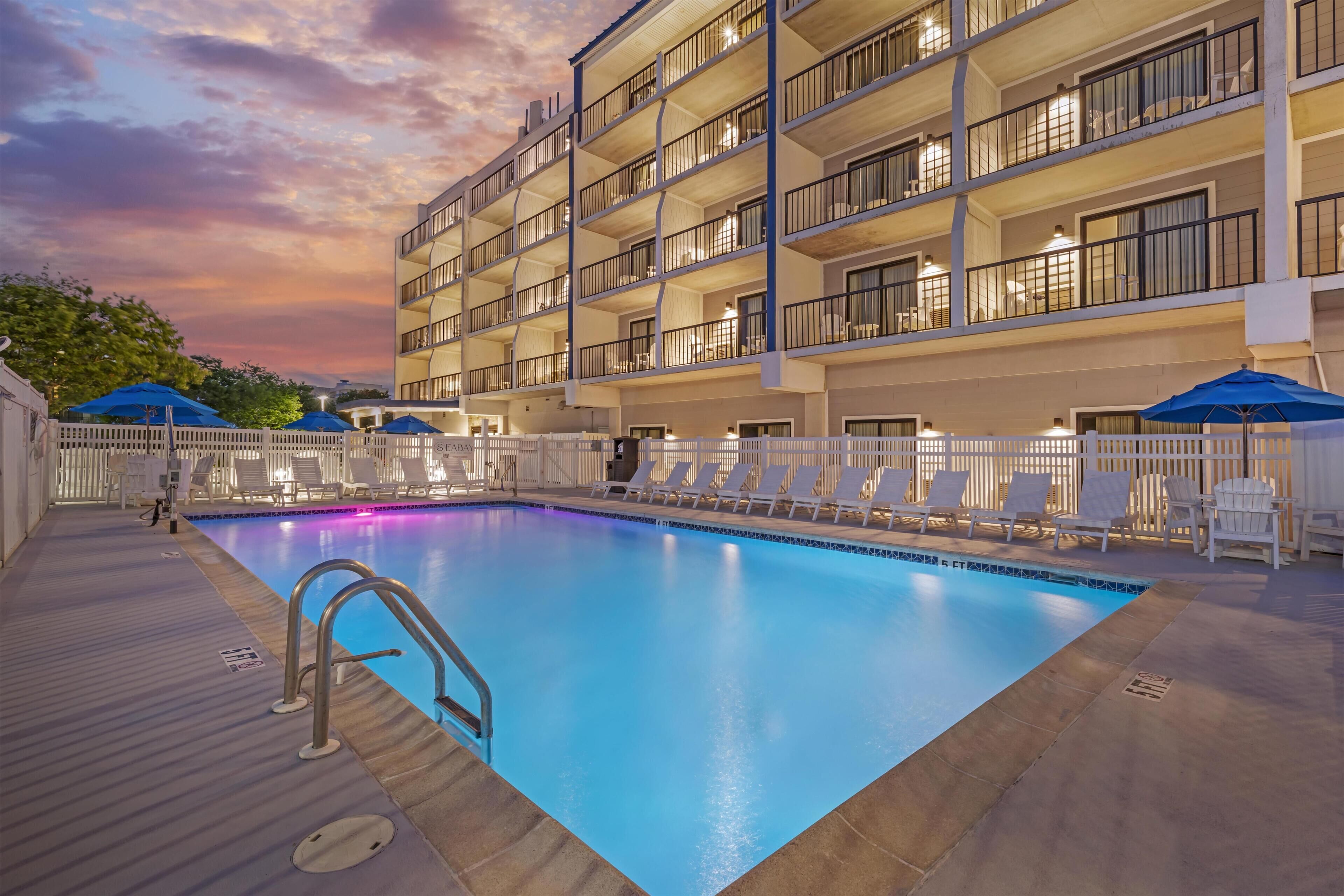 Seasonal outdoor pool, open 9:00 AM to 9:00 PM, pool umbrellas