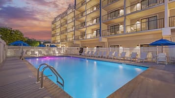 Seasonal outdoor pool, open 9:00 AM to 9:00 PM, pool umbrellas