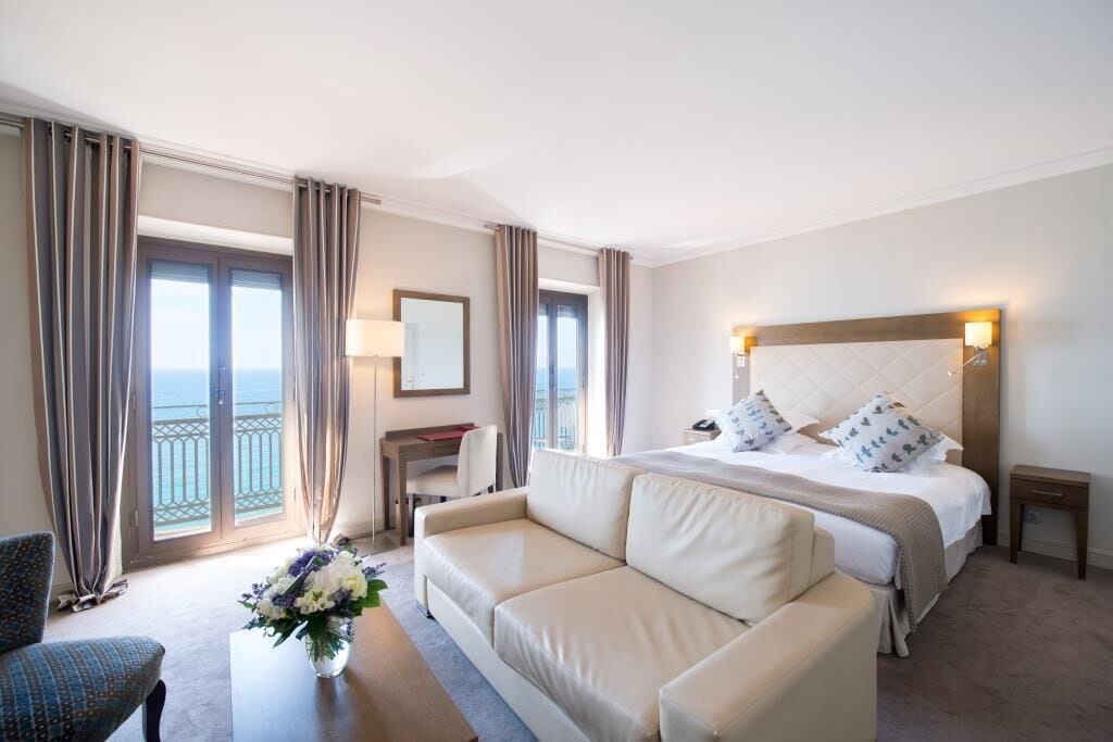 junior suite, 1 queen bed, sea view | 1 bedroom, premium bedding, minibar, in-room safe
