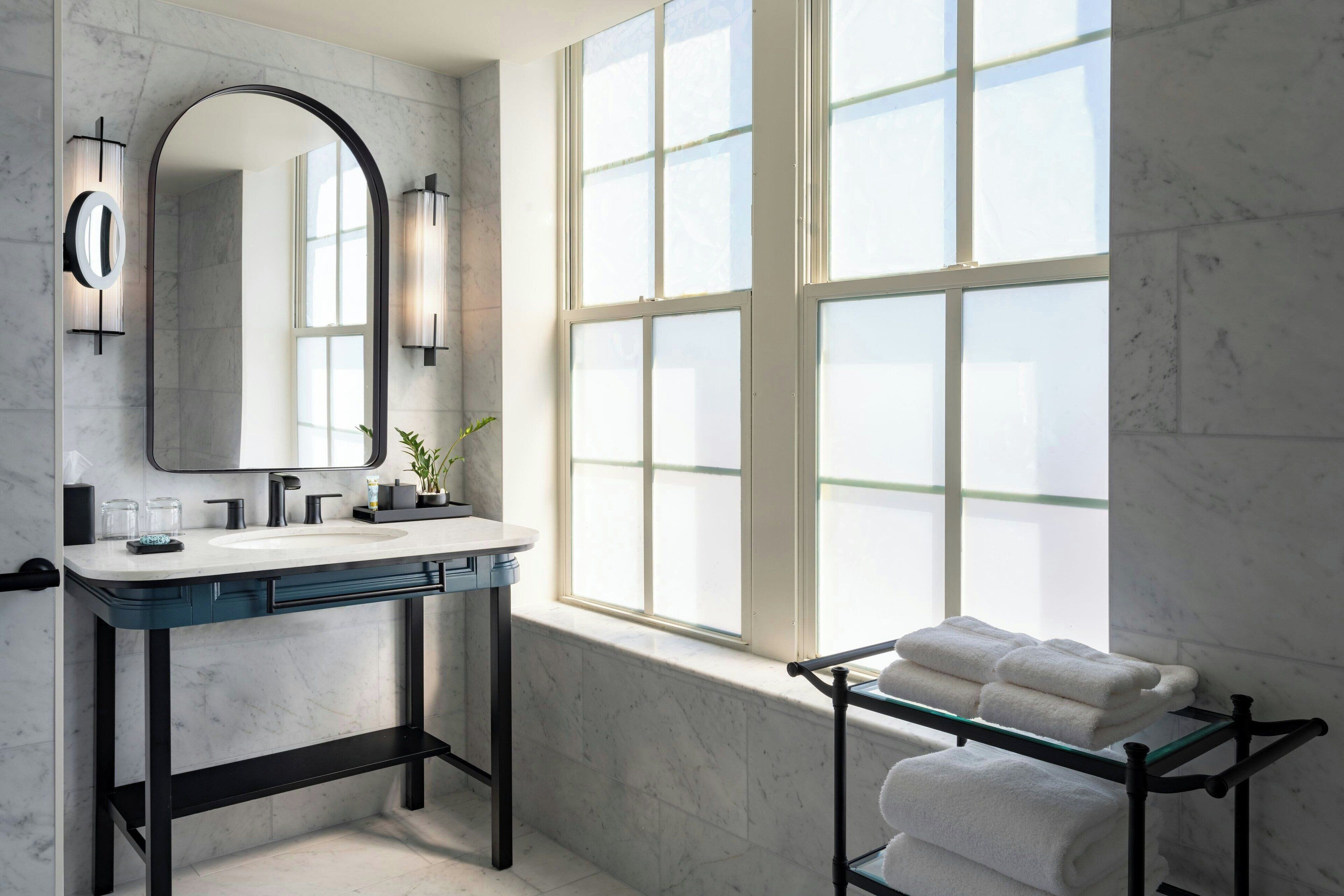 designer toiletries, hair dryer, bathrobes, towels