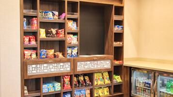 A snack and beverage display area with various packaged snacks and drinks.