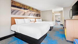 A hotel room with two beds, a large wall mural, a flat-screen TV, and a desk. - Days Inn by Wyndham Mitchell SD (Mitchell)