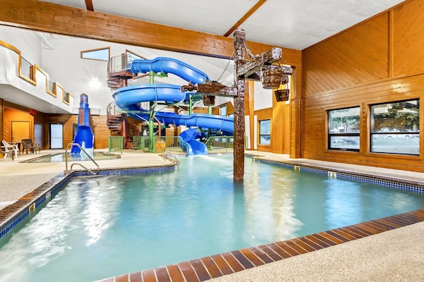 Indoor pool, open 8:00 AM to 10:00 PM, pool loungers