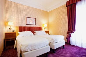 Hypo-allergenic bedding, free minibar items, in-room safe, desk