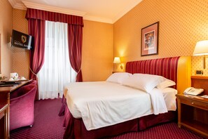 Hypo-allergenic bedding, free minibar items, in-room safe, desk