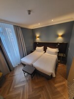 Hypo-allergenic bedding, free minibar items, in-room safe, desk