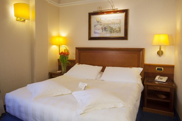 Hypo-allergenic bedding, free minibar items, in-room safe, desk