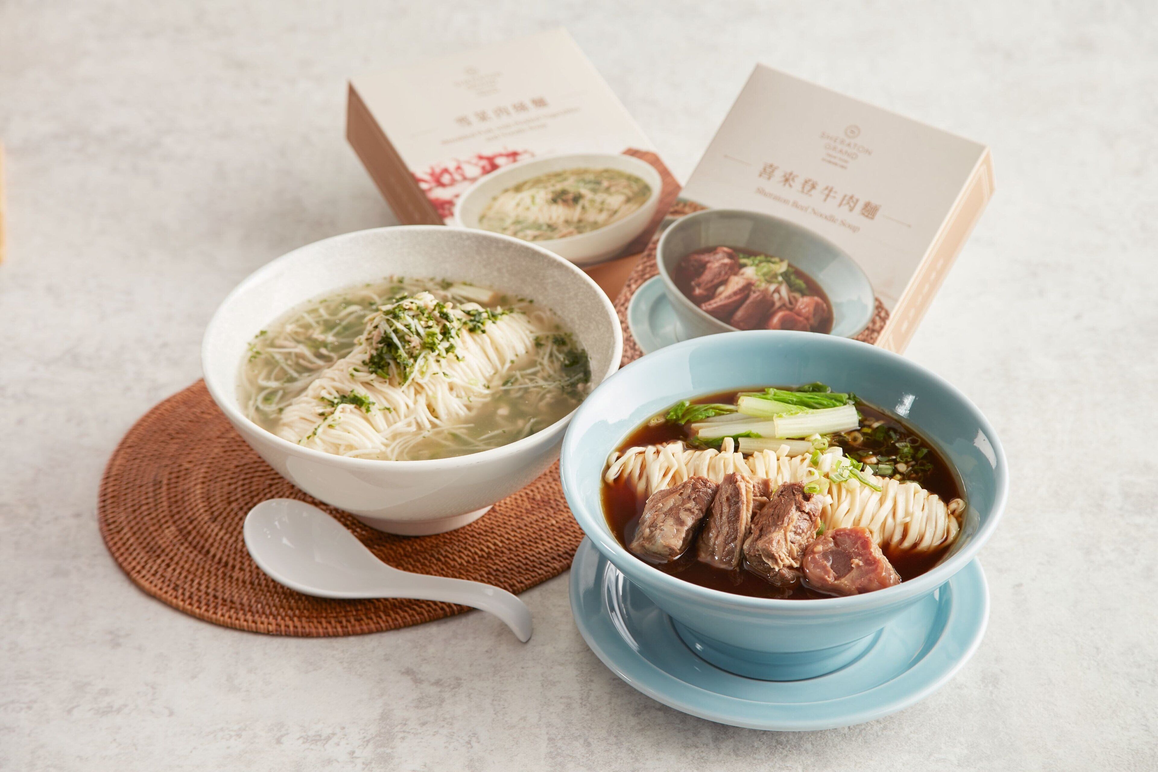 Three bowls of soup with different ingredients, placed on a table with placemats.