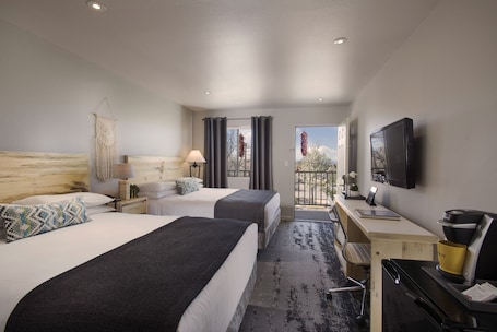Standard Room, 2 Queen Beds (Traditional Double Queen Room) | Desk, laptop workspace, blackout drapes, iron/ironing board. The Sage Hotel