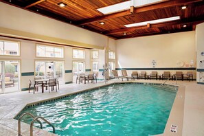 Indoor pool, open 10:00 AM to 10:00 PM, pool umbrellas, pool loungers