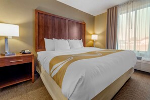 Desk, laptop workspace, blackout drapes, iron/ironing board