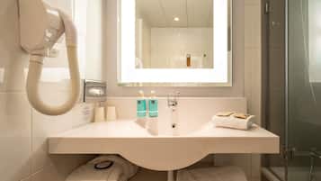 Eco-friendly toiletries, hair dryer, towels, soap