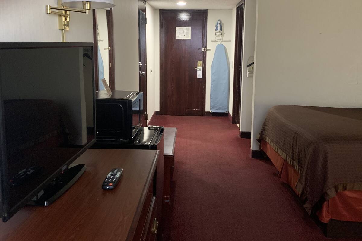 Basic Double Room Single Use | In-room safe, desk, laptop workspace, blackout drapes
