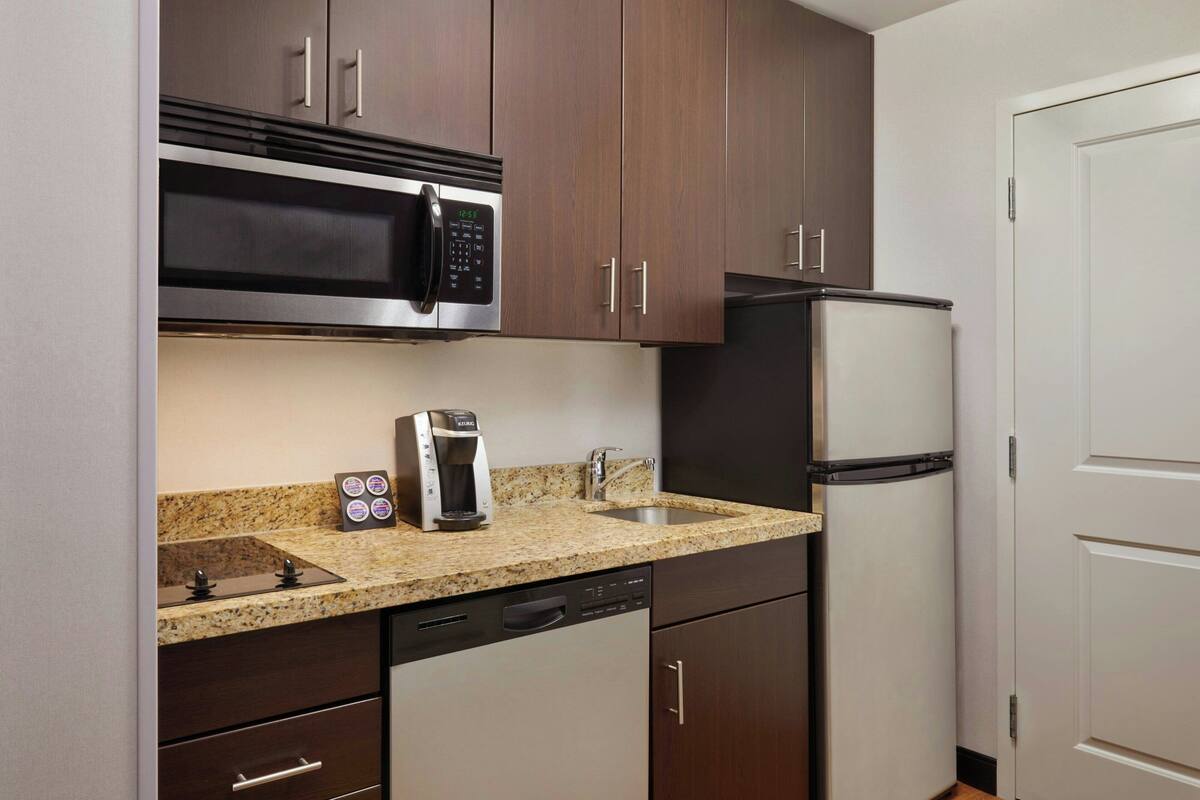 studio, 1 king bed with sofa bed | private kitchen | full-sized fridge, microwave, stovetop, dishwasher