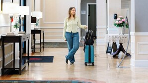 A spacious lobby with a chandelier, a luggage stand, and a reception desk. - Millennium Hotel Durham (Durham)