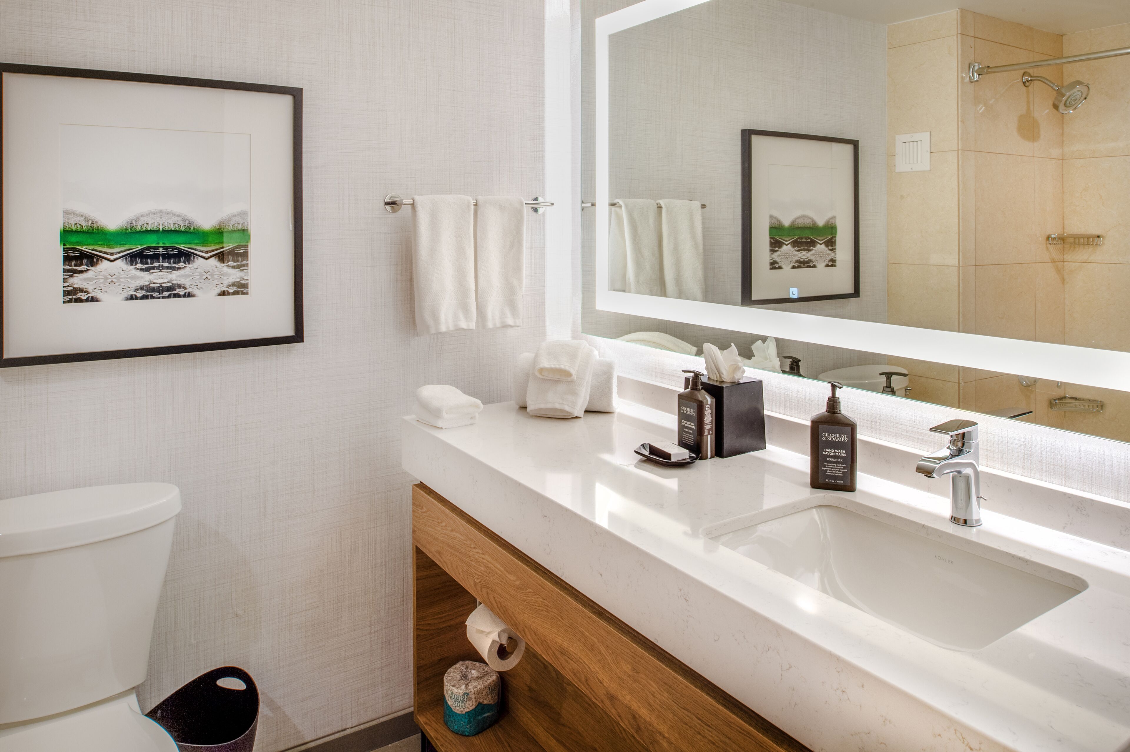 combined shower/bathtub, designer toiletries, hair dryer, towels