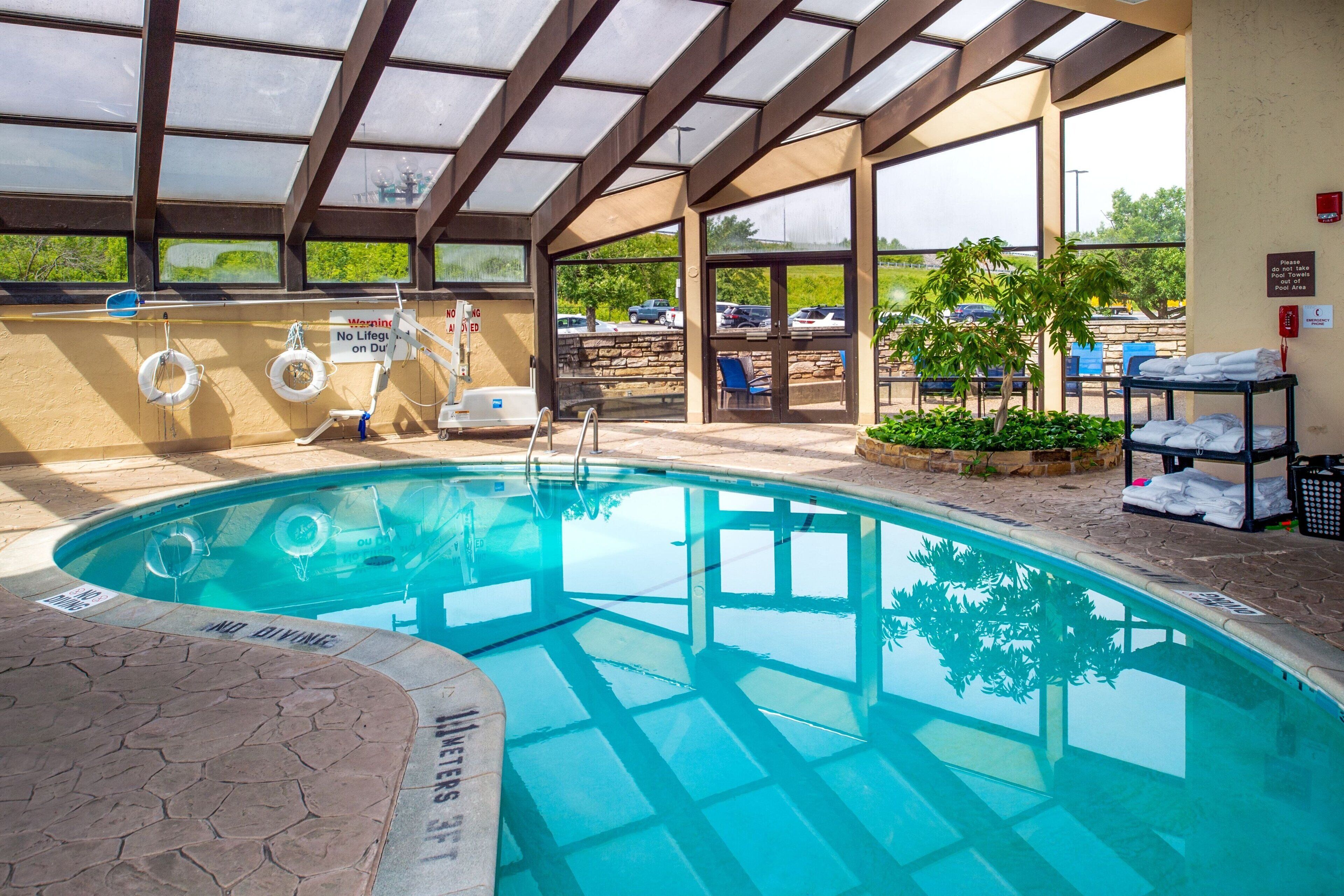 indoor pool, seasonal outdoor pool, pool umbrellas