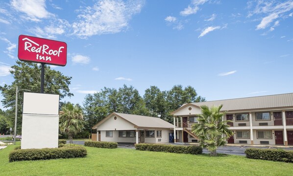 Simple, functional architecture and a well-manicured lawn surround this charming property.