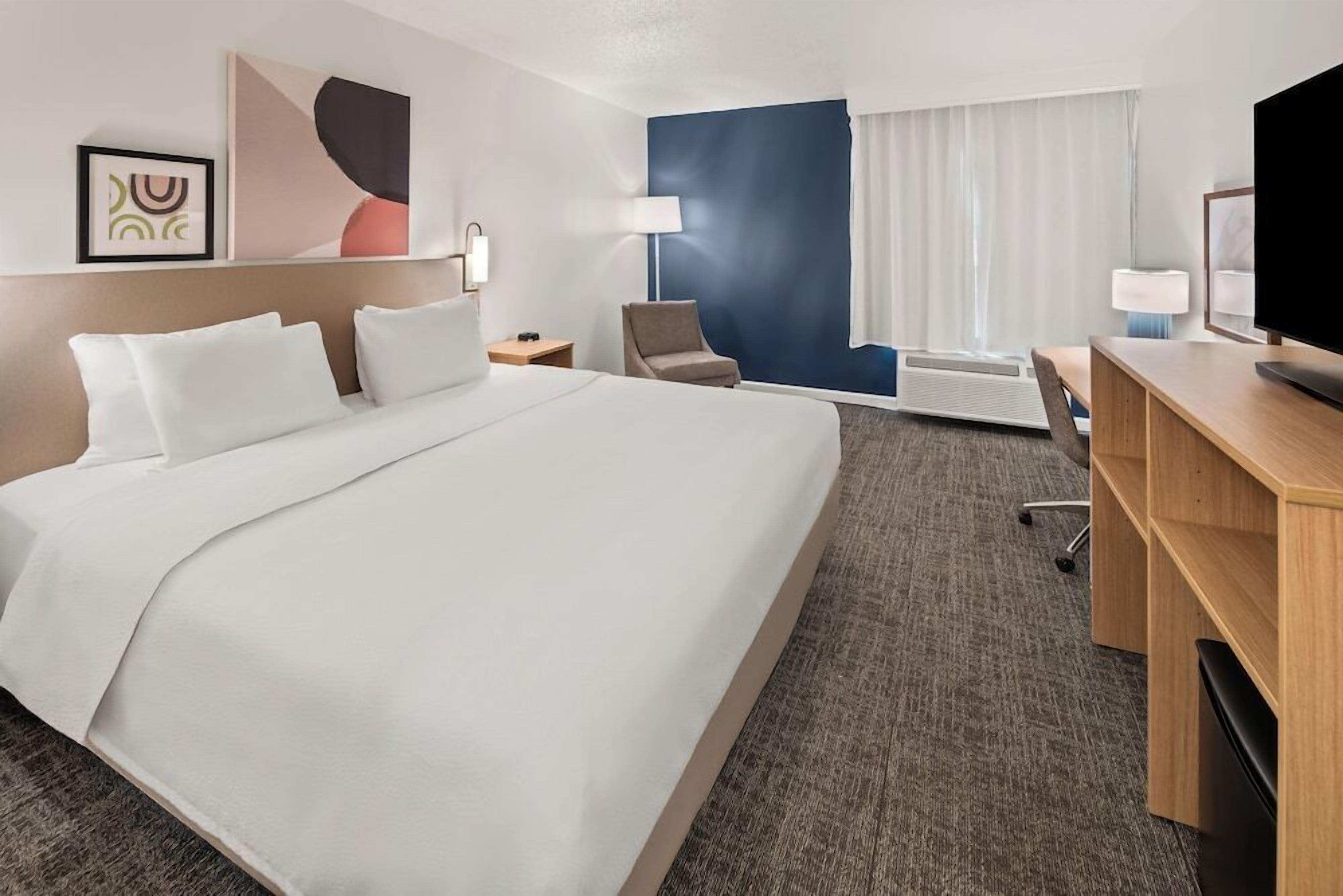 Luxe beddengoed, pillowtop-bedden, een kluis op de kamer, een bureau