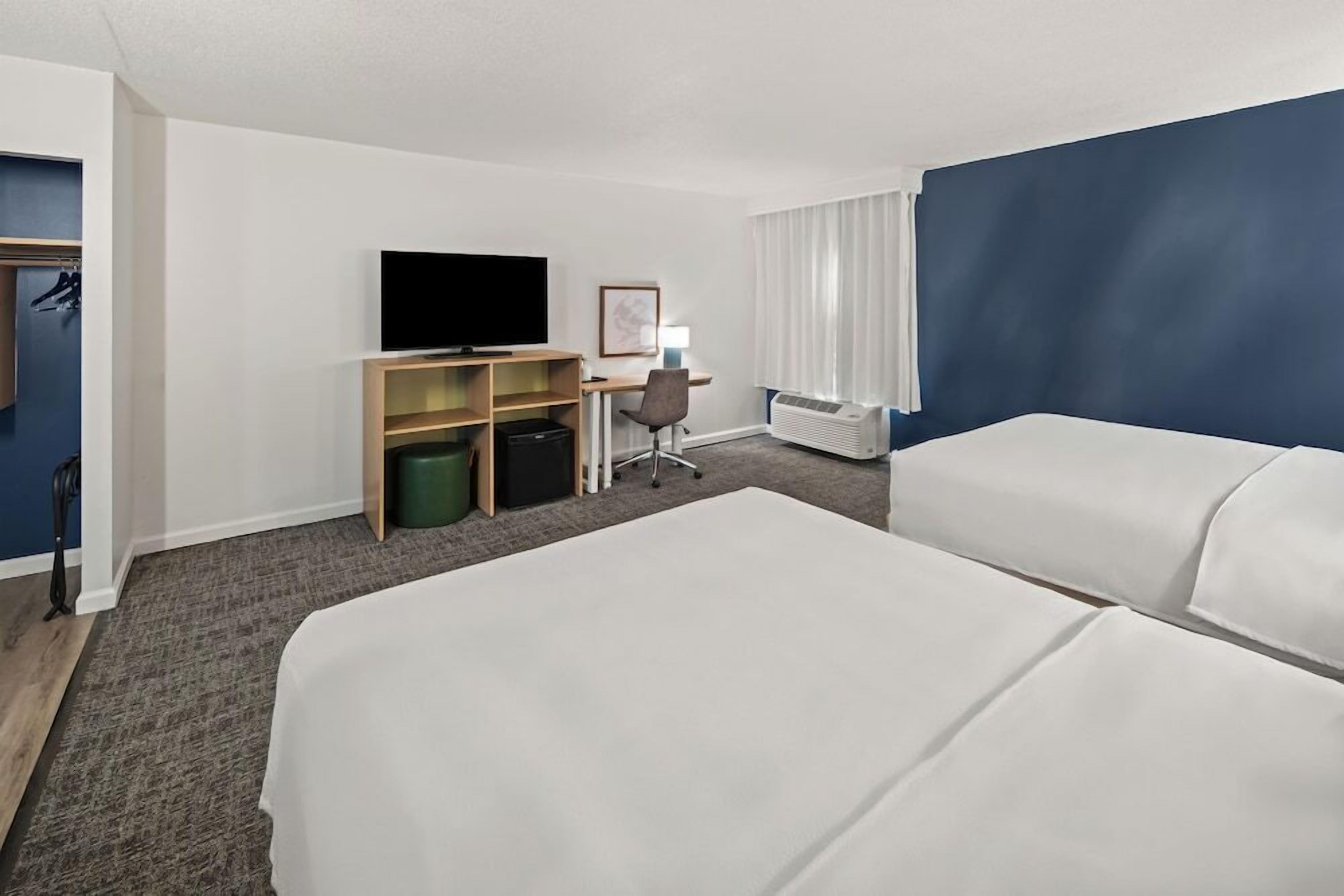 Luxe beddengoed, pillowtop-bedden, een kluis op de kamer, een bureau
