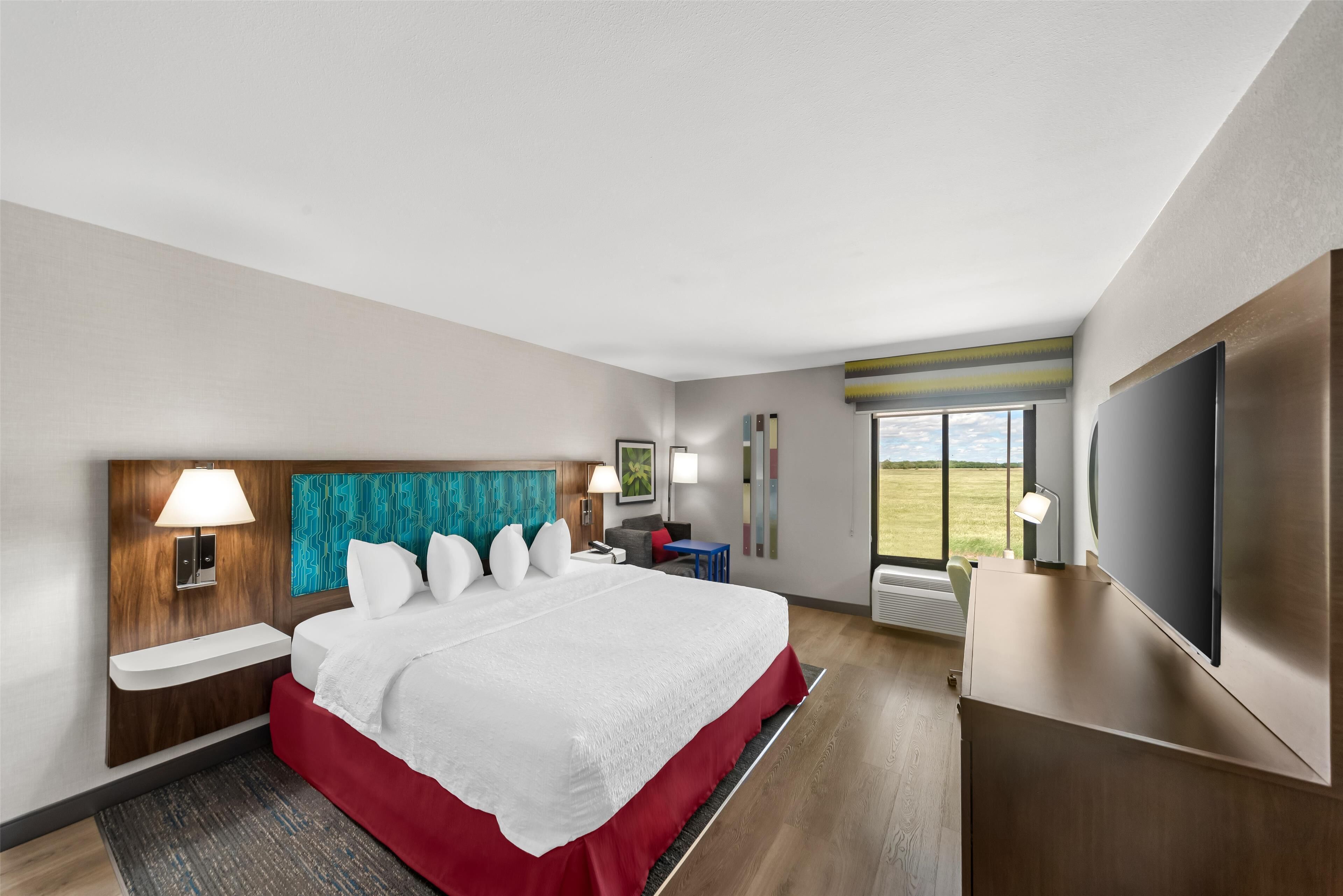 room, 1 king bed, roll-in shower, non smoking | in-room safe, soundproofing, iron/ironing board, free cots/infant beds