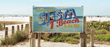 A beach sign for Sarasota, Florida, stating it's the #1 beach in the USA.