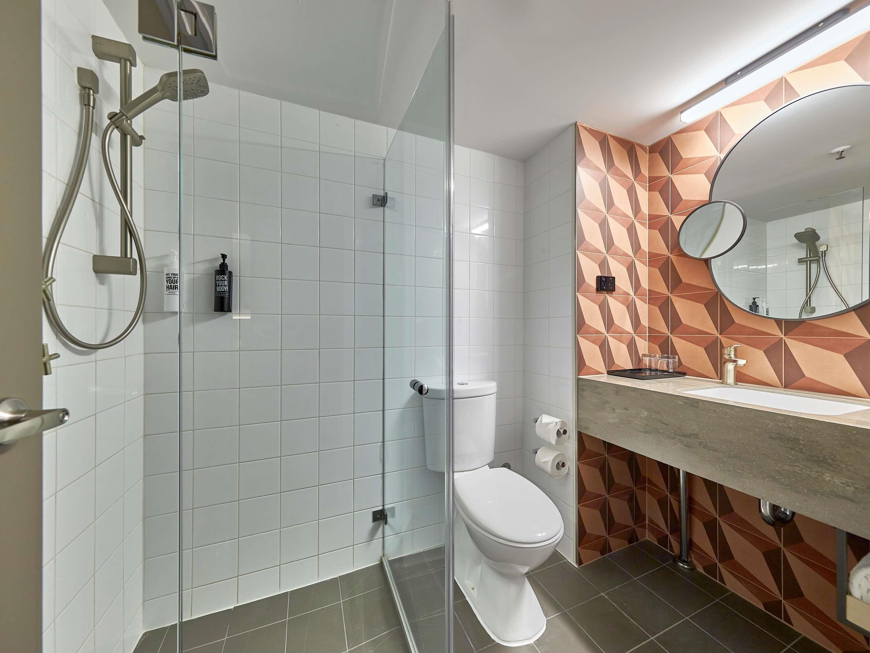 Shower, eco-friendly toiletries, hair dryer, towels