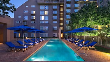 Outdoor pool, open 6 AM to 10 PM, pool umbrellas, pool loungers