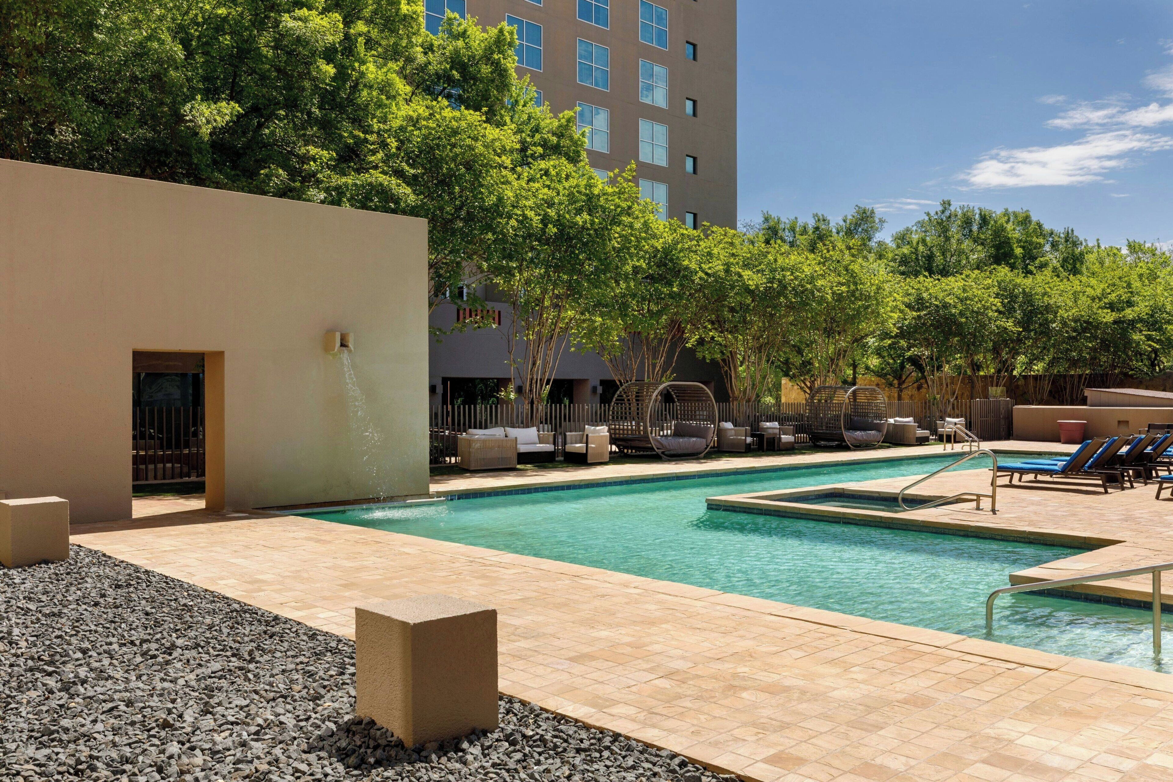 Outdoor pool, open 6 AM to 10 PM, pool umbrellas, sun loungers