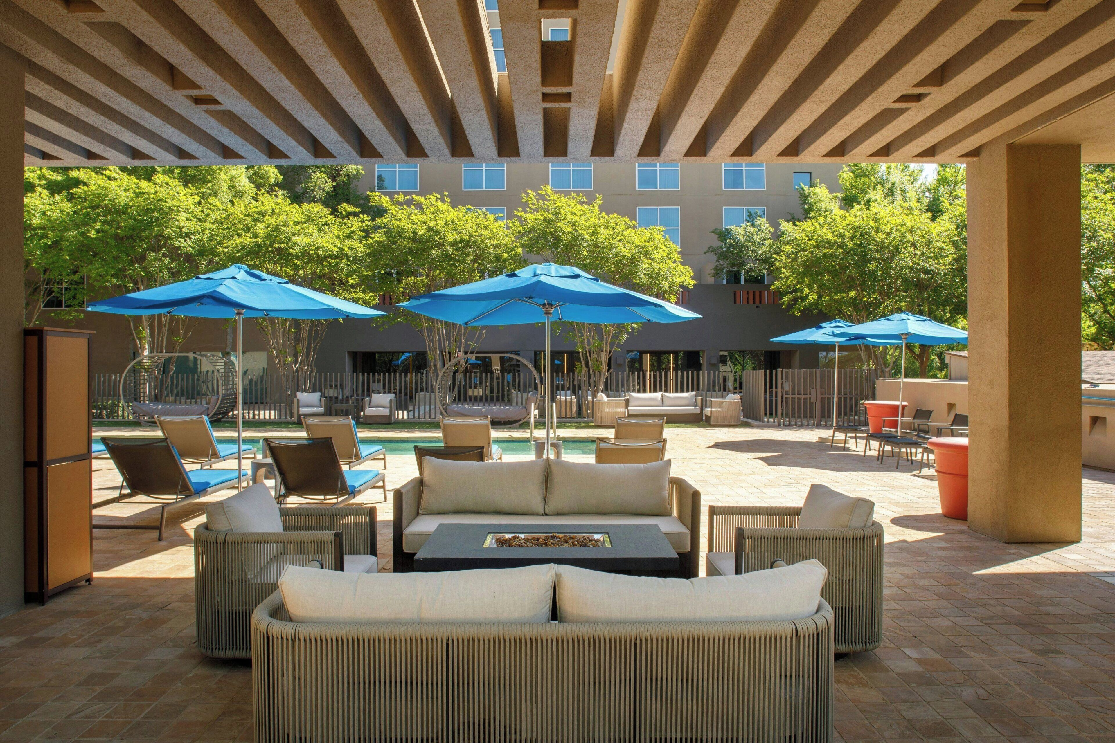Outdoor pool, open 6 AM to 10 PM, pool umbrellas, sun loungers