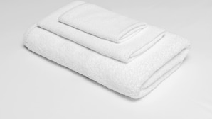 A neatly folded white towel. - Twinkle Inn (Branson)