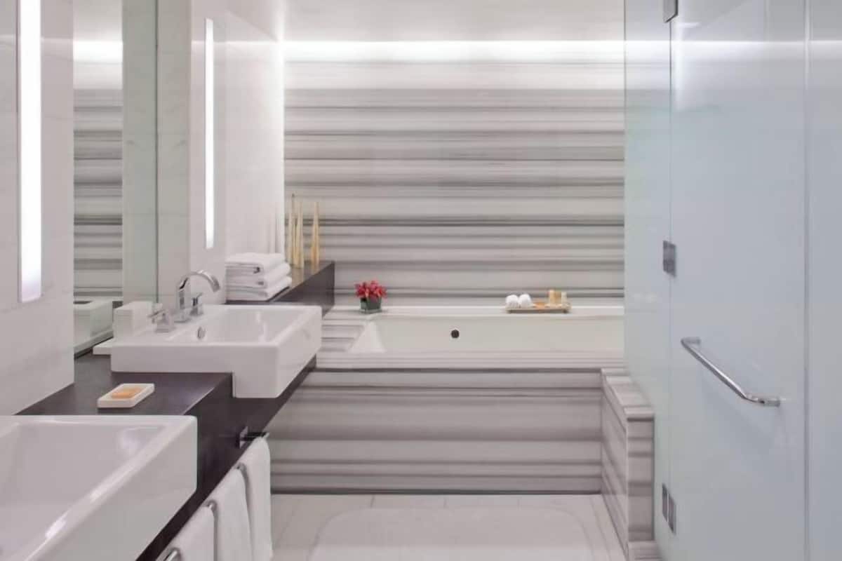 Bathroom | Designer toiletries, hair dryer, towels, soap