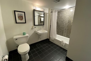 Suite, 1 King Bed, Non Smoking | Bathroom | Combined shower/tub, free toiletries, hair dryer, towels