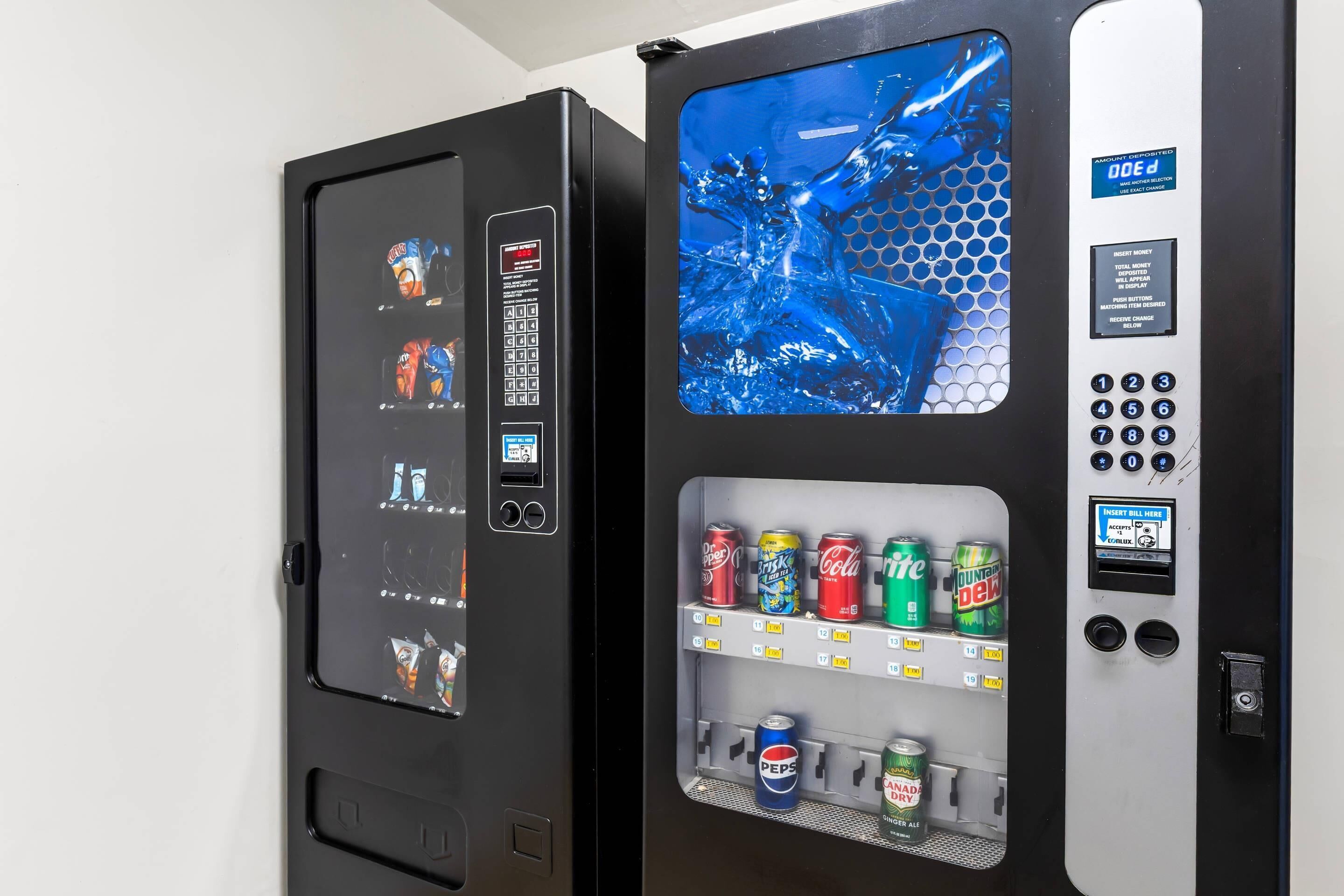 Two vending machines with a variety of beverages and snacks.