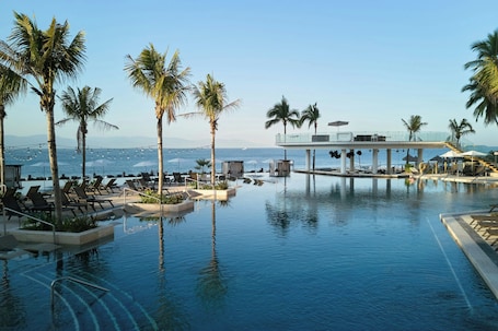 Indoor pool, outdoor pool, pool umbrellas. Marriott Puerto Vallarta Resort & Spa