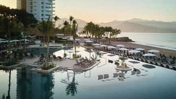 Indoor pool, outdoor pool, pool umbrellas