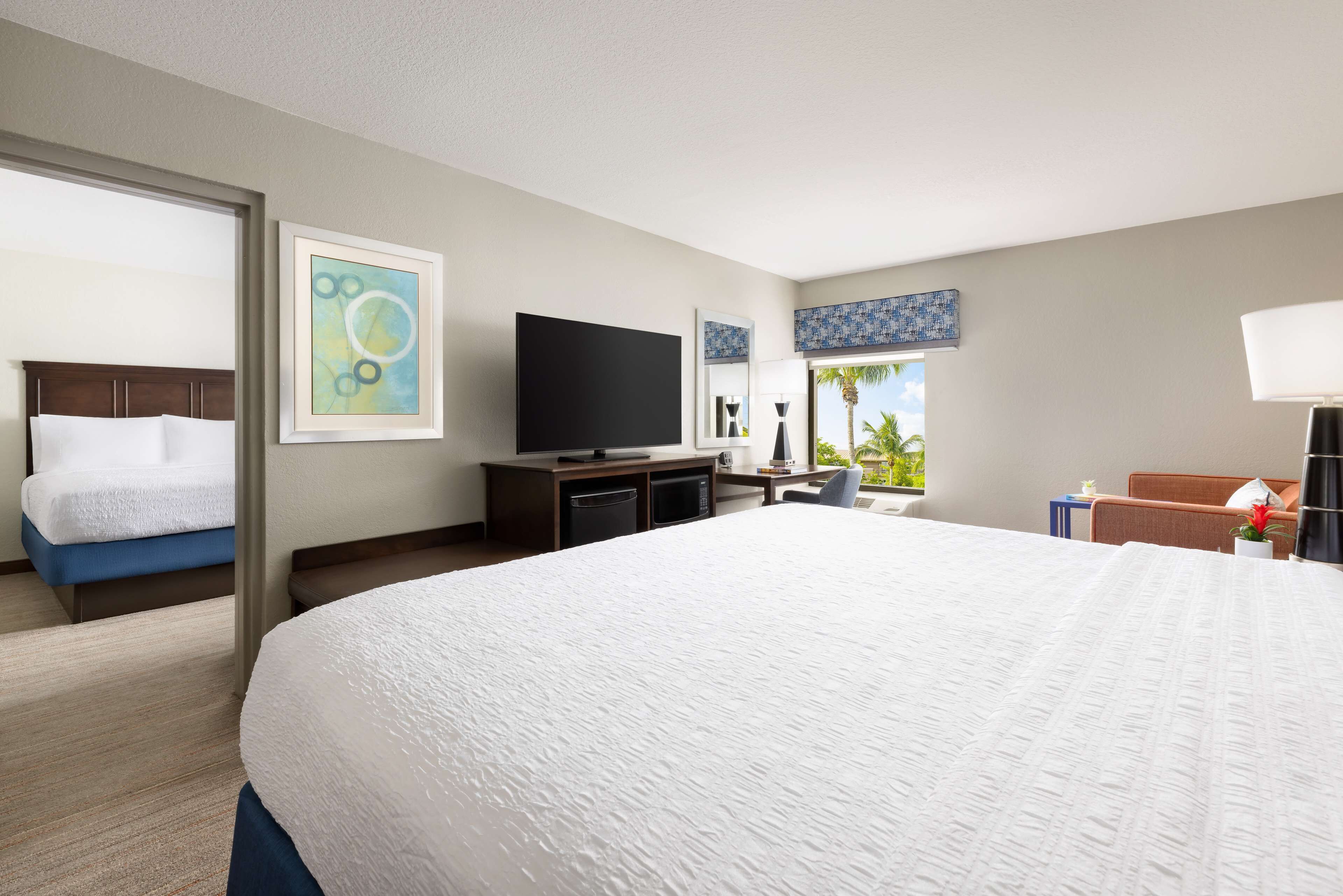 family suite, 1 king bed, non smoking | in-room safe, desk, laptop workspace, iron/ironing board