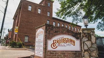 A historic building with a sign indicating it is the Brookstown Mill from 1837.