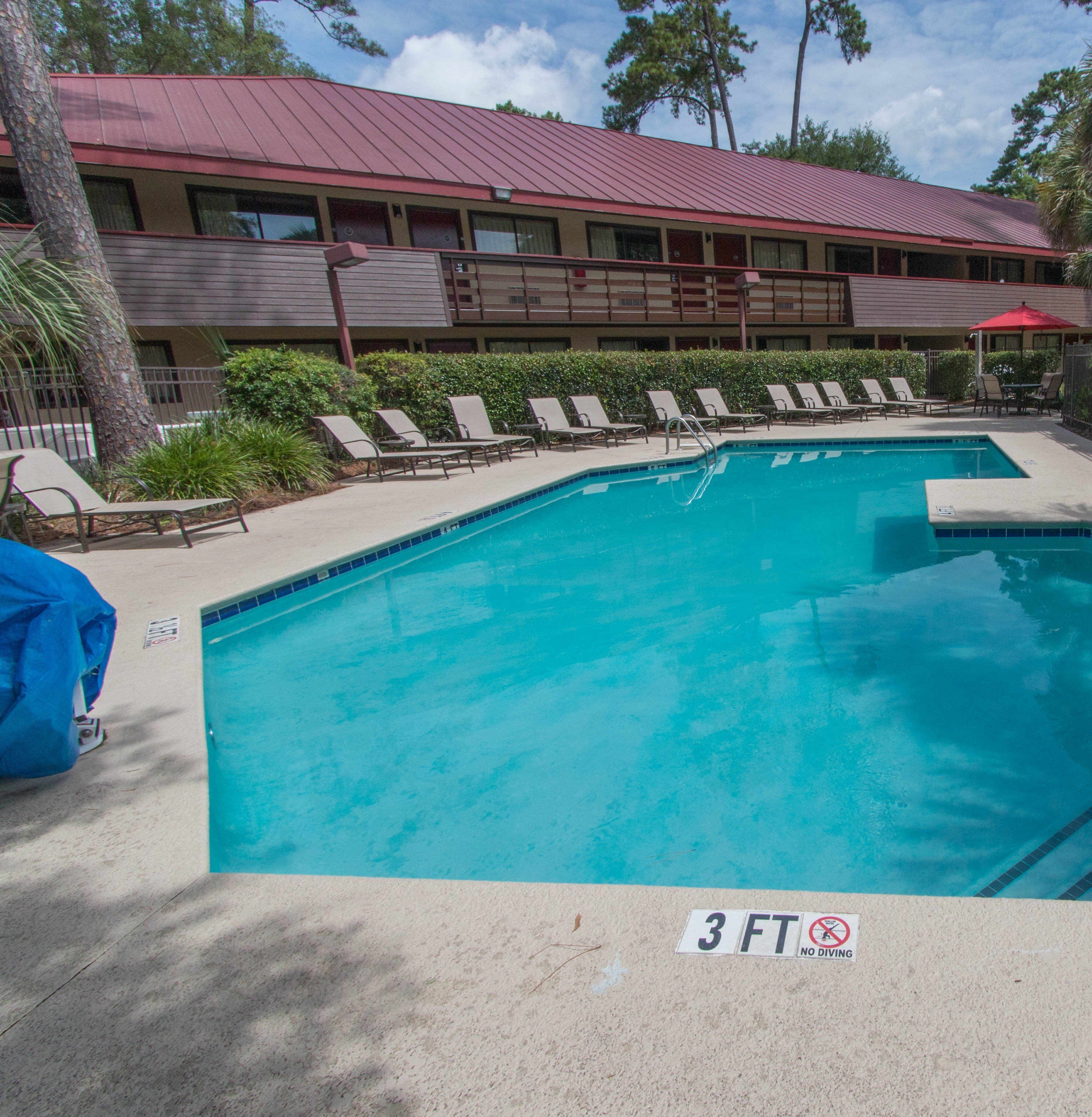 Seasonal outdoor pool, open 10:00 AM to 7:00 PM, pool umbrellas