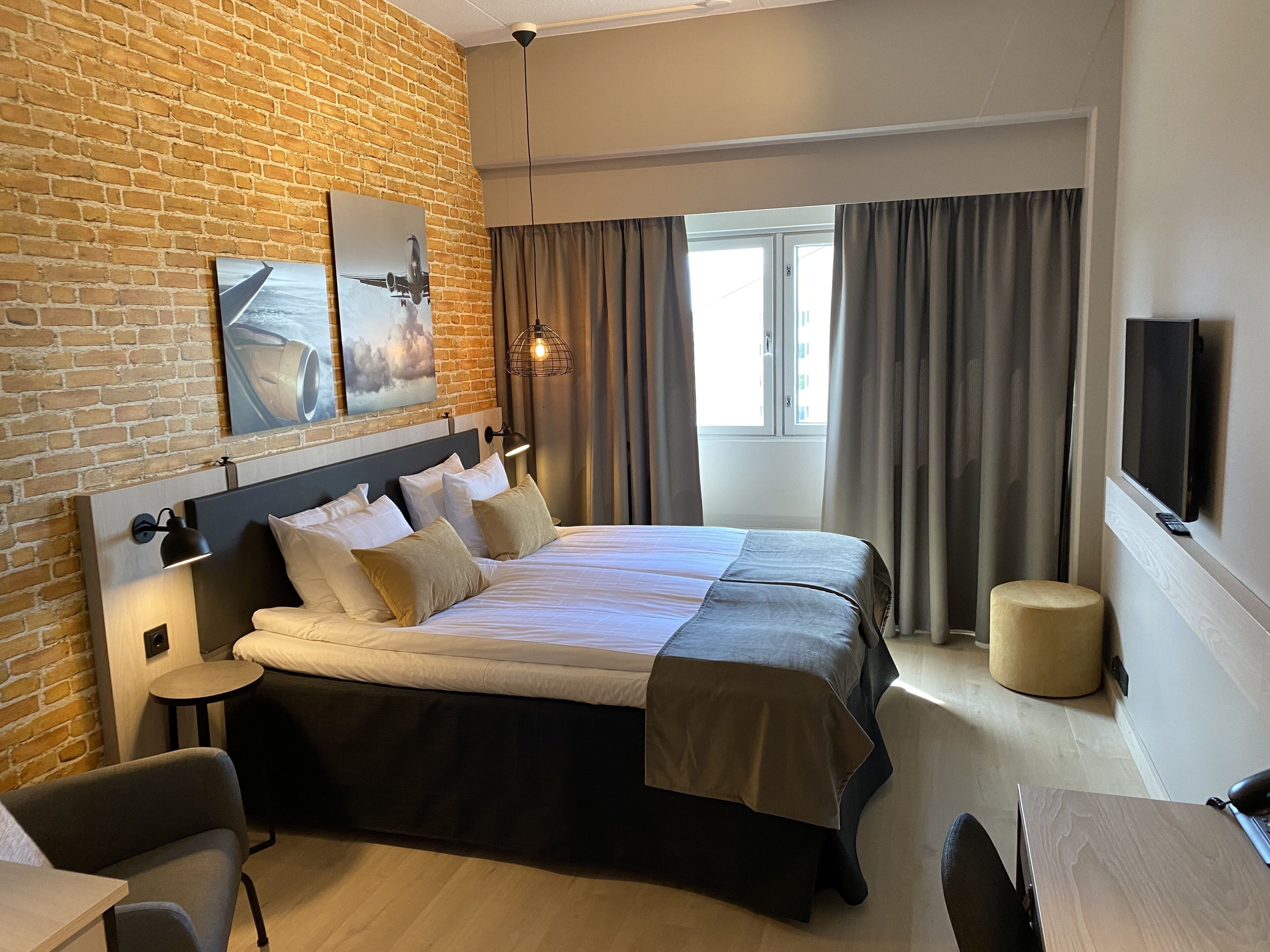 Hypo-allergenic bedding, desk, laptop workspace, blackout curtains