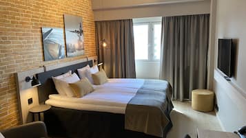 Hypo-allergenic bedding, desk, laptop workspace, blackout curtains