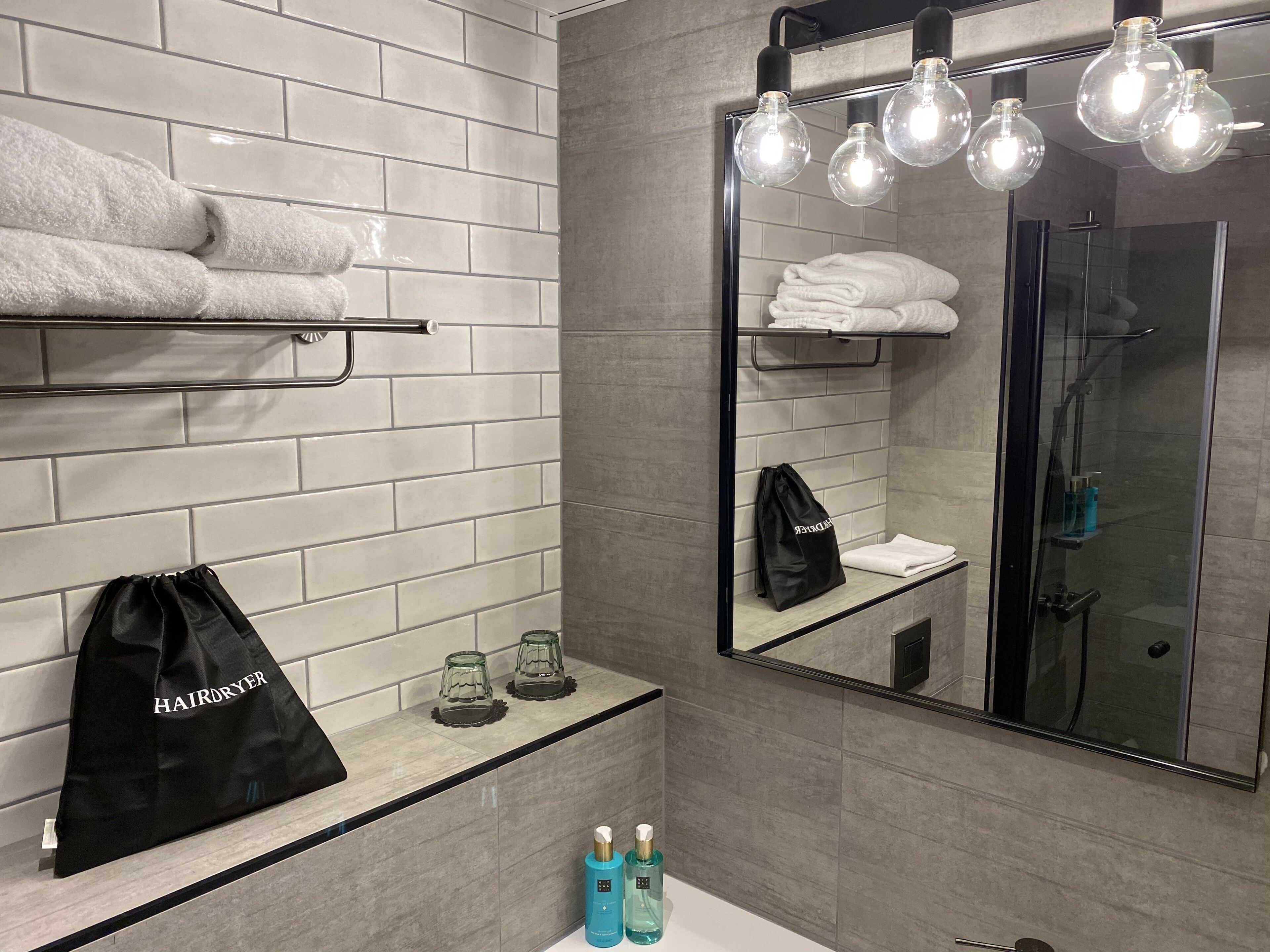 business twin room | bathroom | shower, towels, soap, shampoo