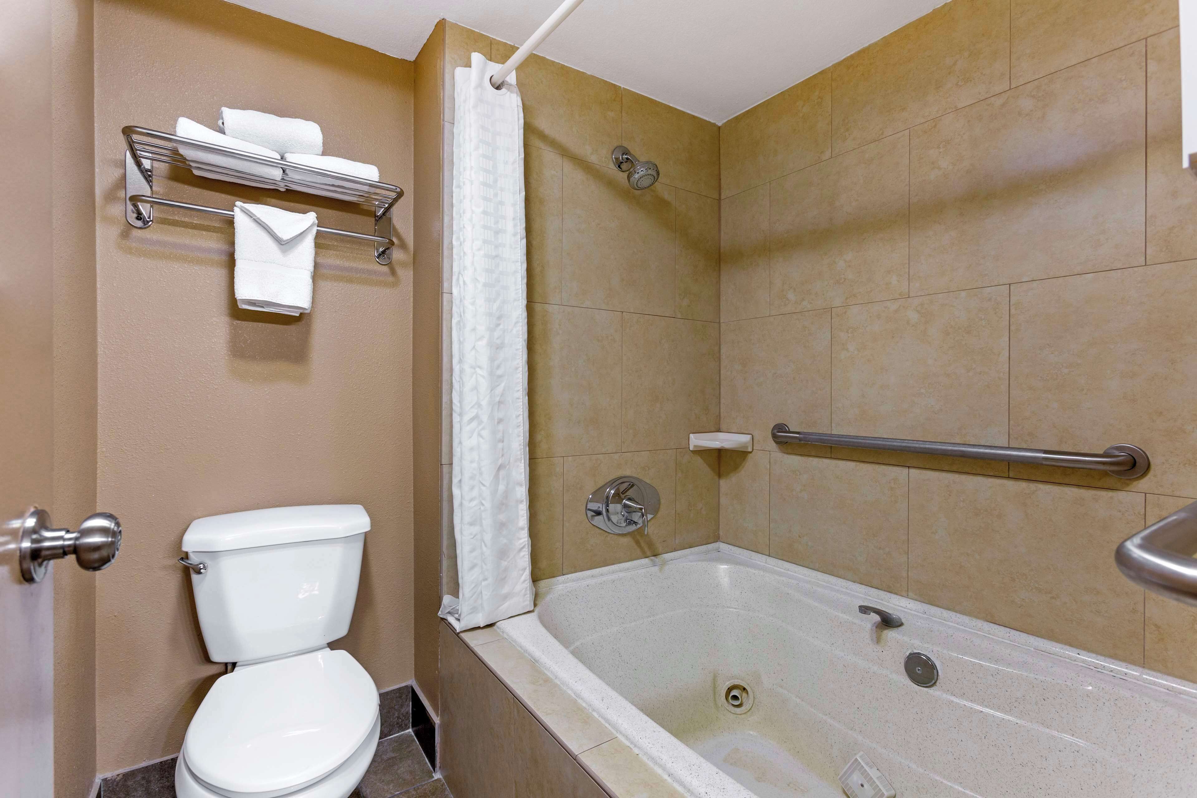 suite, 2 queen beds, non smoking, jetted tub (with sofabed) | bathroom | shower, free toiletries, hair dryer, towels