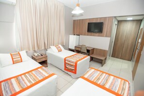 Executive Triple Room | Minibar, desk, laptop workspace, blackout drapes