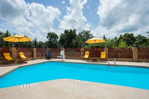 Seasonal outdoor pool, open 3:00 PM to 9:30 PM, pool loungers