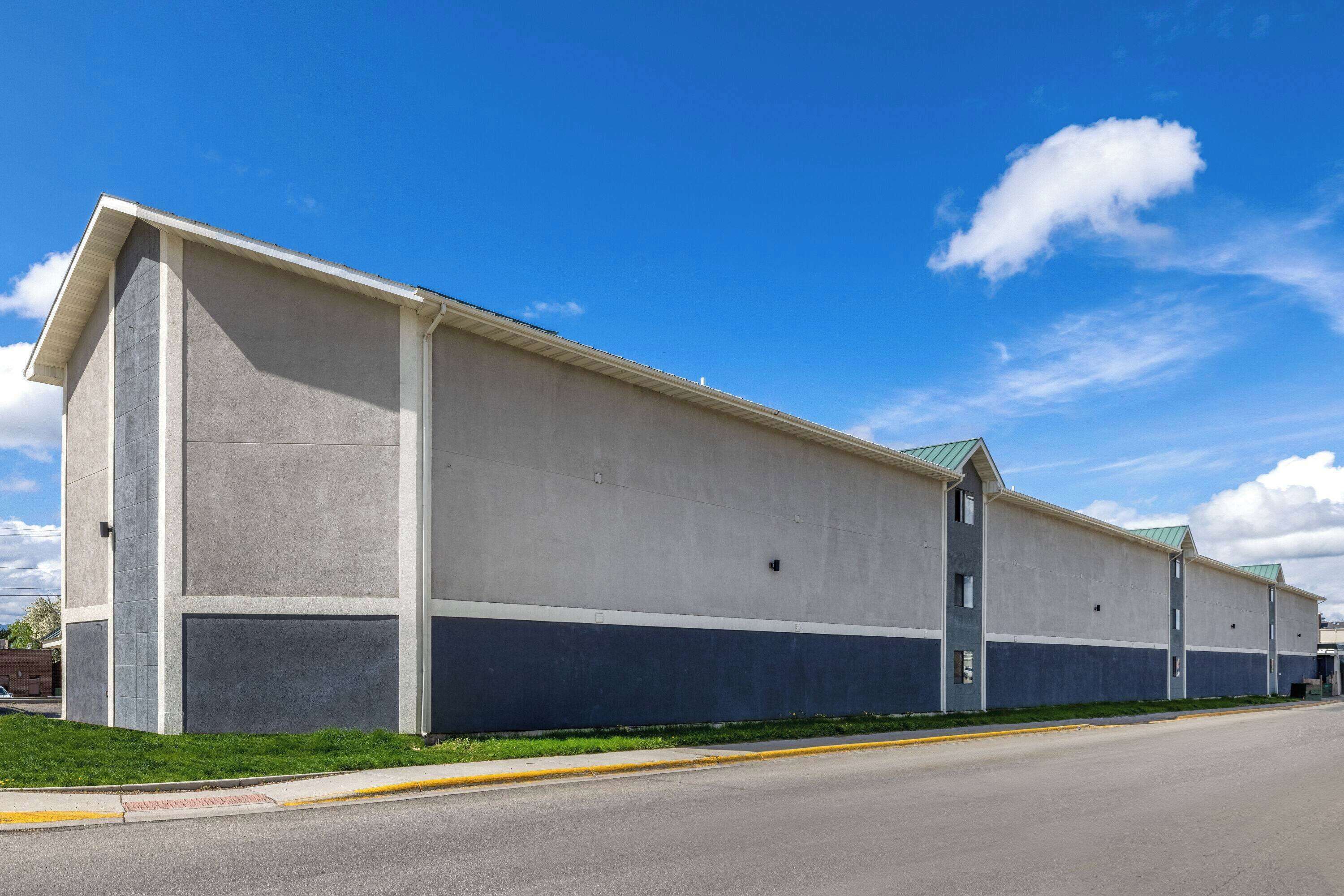 A long, single-story building with a flat roof and a simple, rectangular design.