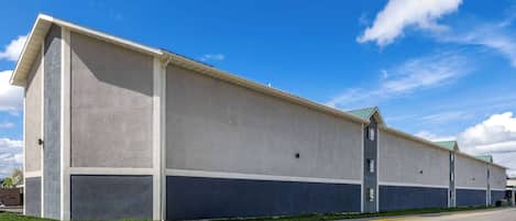 A long, single-story building with a flat roof and a simple, rectangular design.
