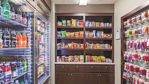 A vending machine area with various snacks and drinks. - Travelodge by Wyndham Houston Cy-Fair (Houston)