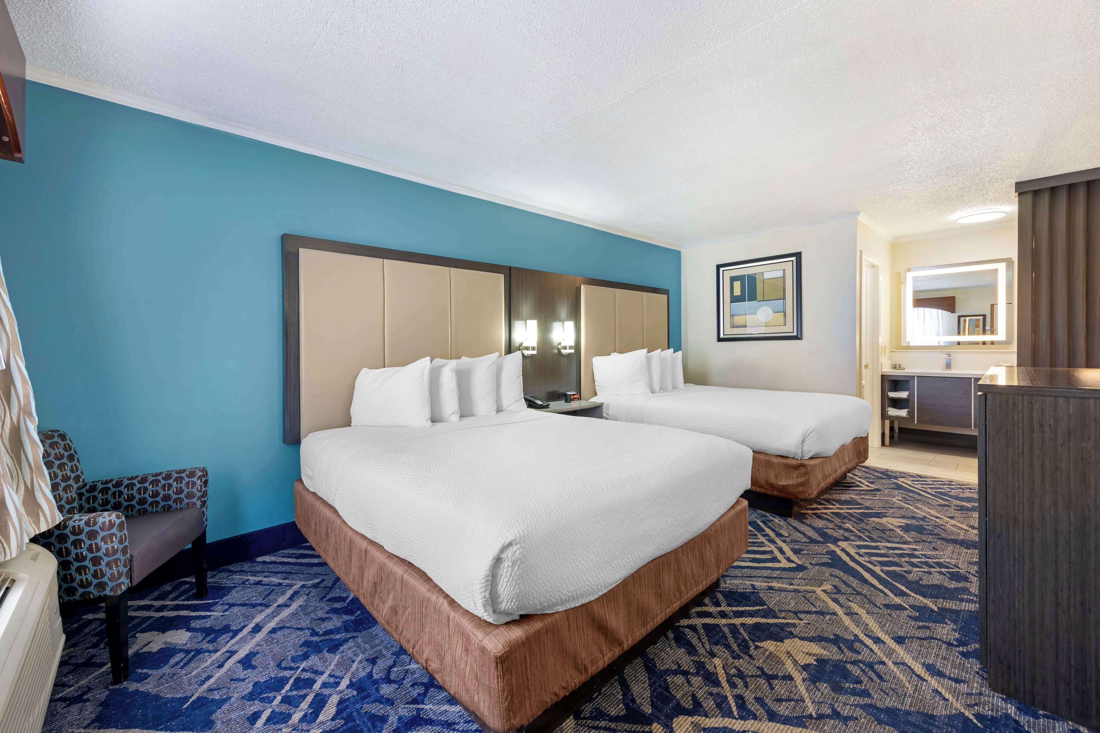 standard room, 2 queen beds, non smoking, refrigerator | pillow-top beds, in-room safe, individually furnished, desk