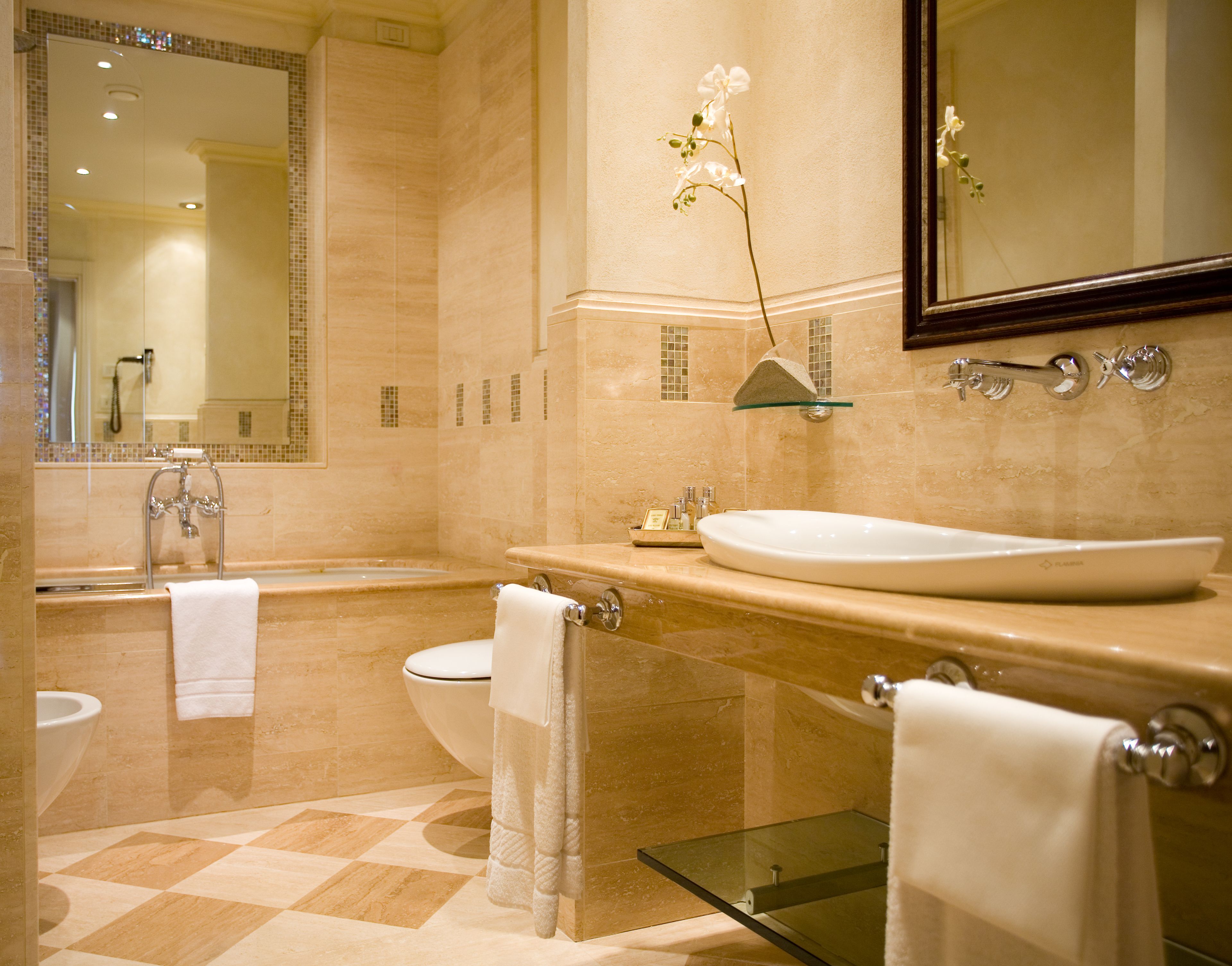 designer toiletries, hair dryer, bidet, towels